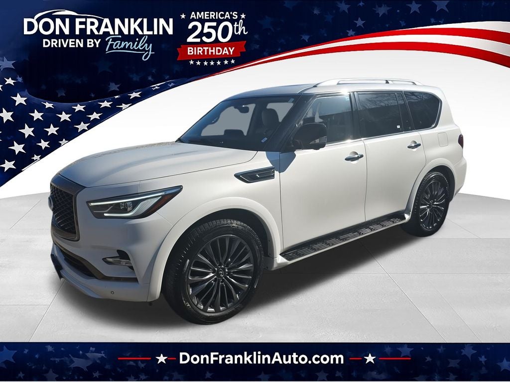 2022 INFINITI QX80 Premium Select in Moonstone White — front three-quarter view